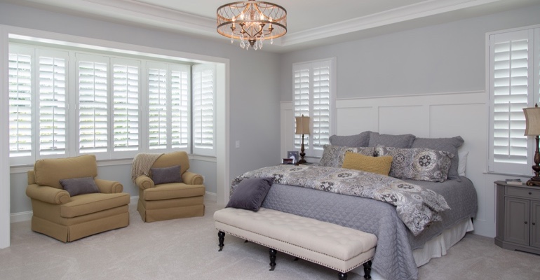 Plantation shutters in Tampa bedroom.